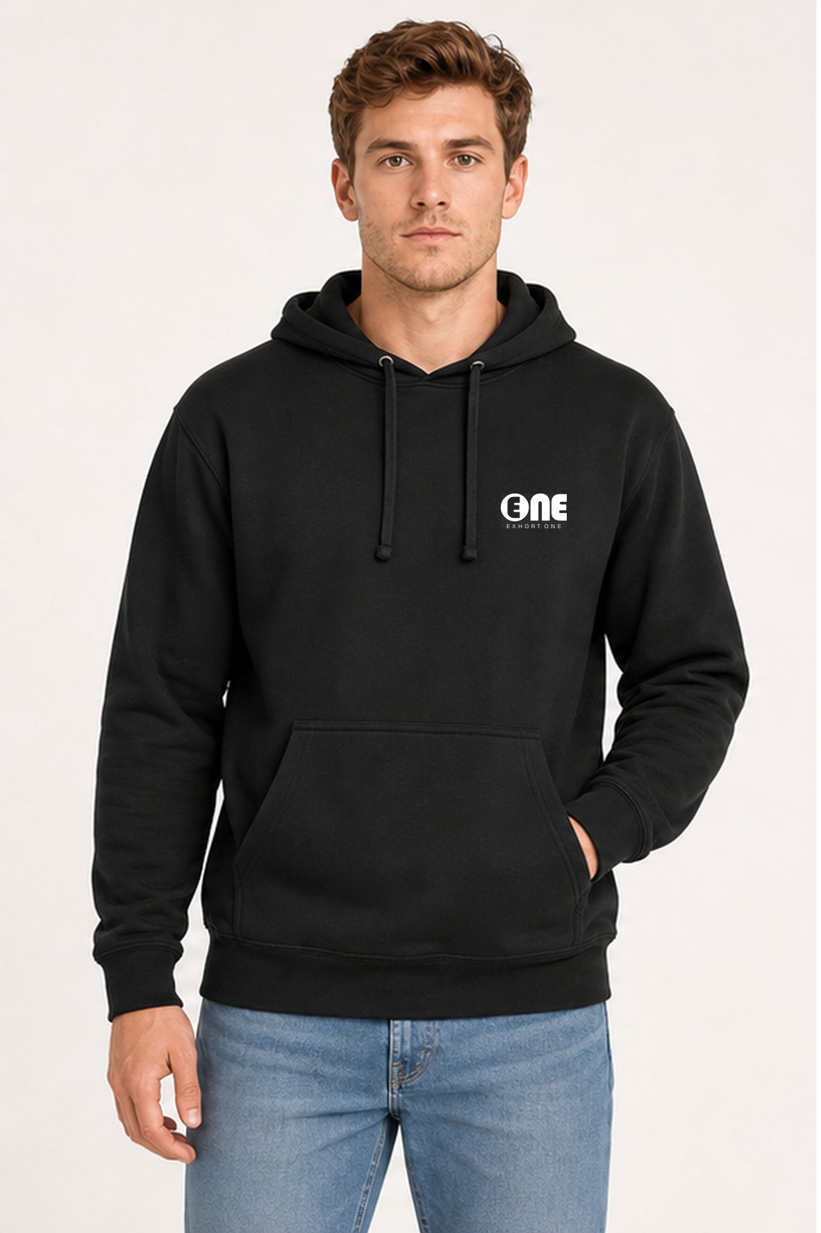 A man wearing a black pullover hoodie with a white 'ONE' logo on the left chest, paired with blue jeans, photographed against a plain light background.