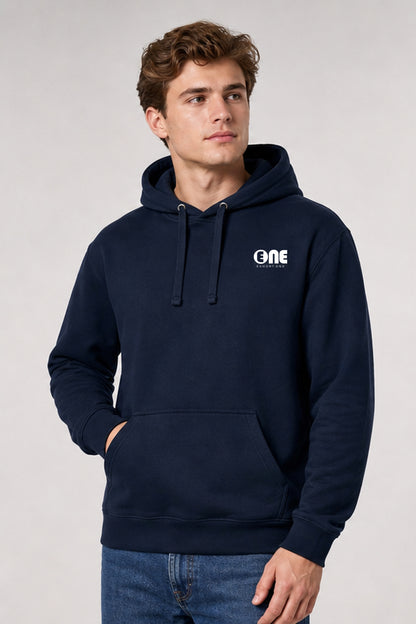 A man wearing a navy blue pullover hoodie with a white 'ONE' logo on the left chest, paired with blue jeans, photographed against a neutral light gray background.